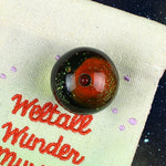 Weltall-Wundermurmel dunkelrot mit Sternenglitzer
